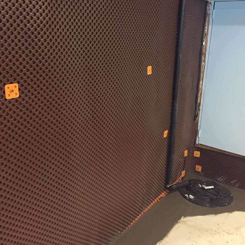 Basement waterproofing job site